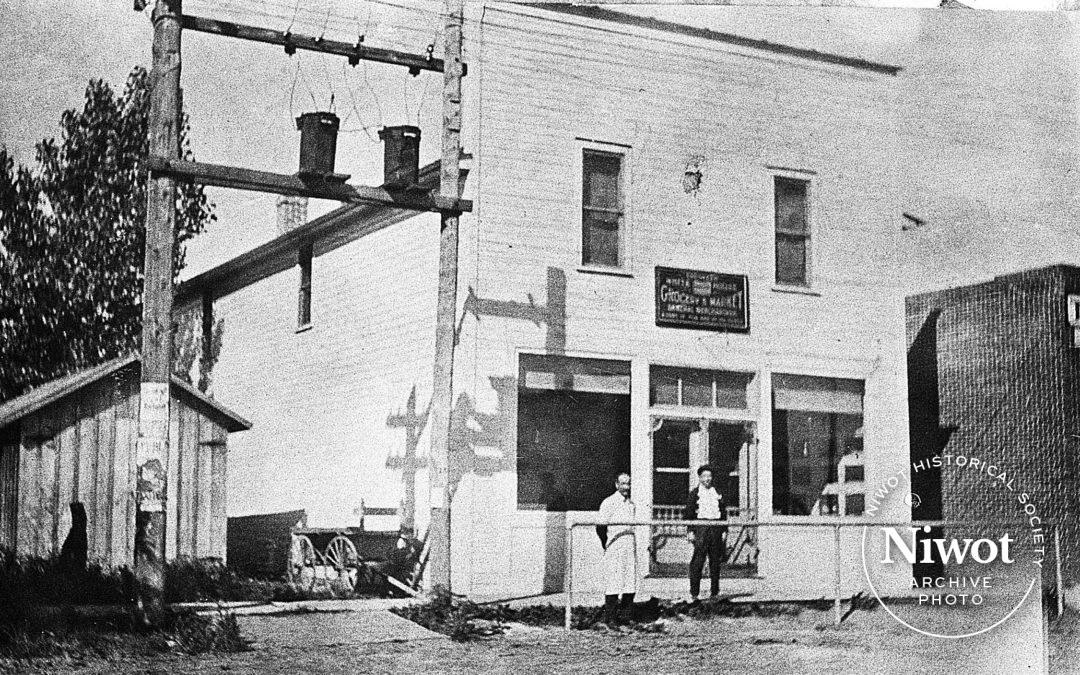 Rev. Taylor in Front of His Store